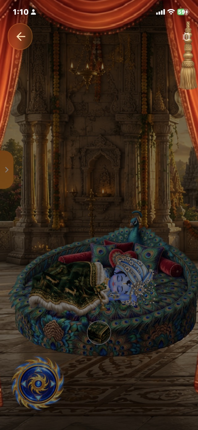 Laddu Gopal Shayan – Bal Krishna sleeping on a peacock bed under a blanket